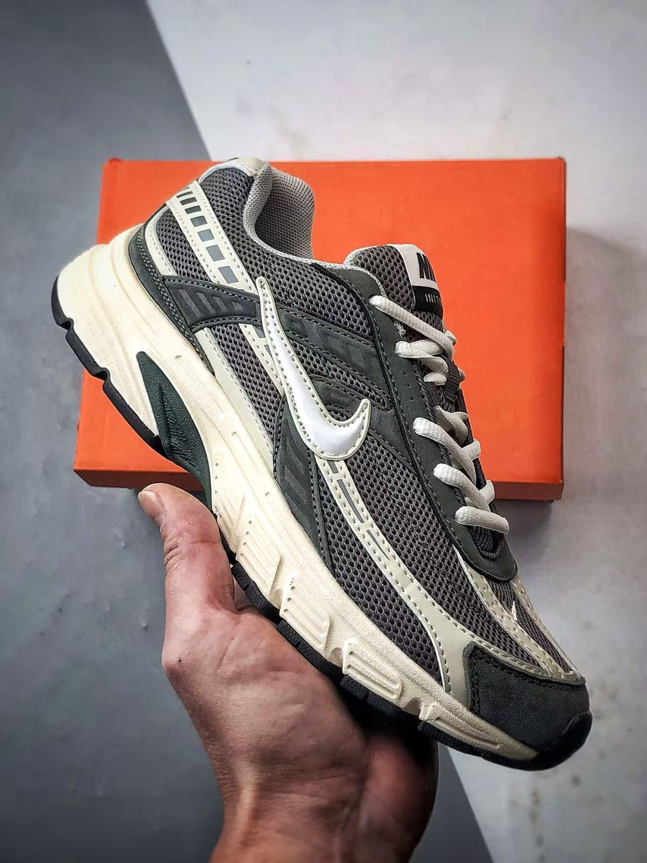 Nike Initiator in Dark Green: Grounded Heritage