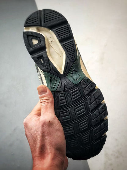 Nike Initiator in Dark Green: Grounded Heritage