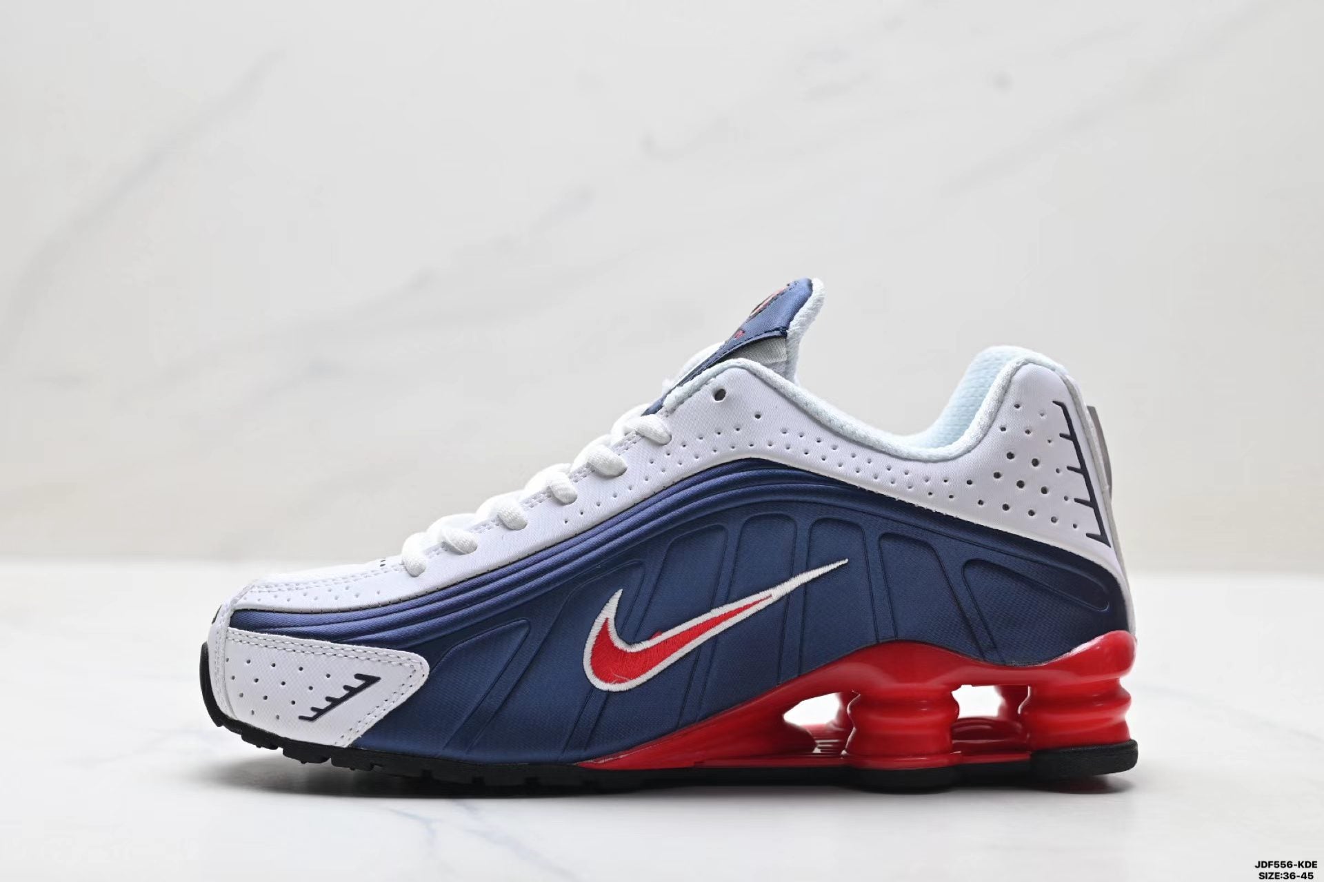 Nike Shox R4 in Blue/White/Red: Futuristic Retro