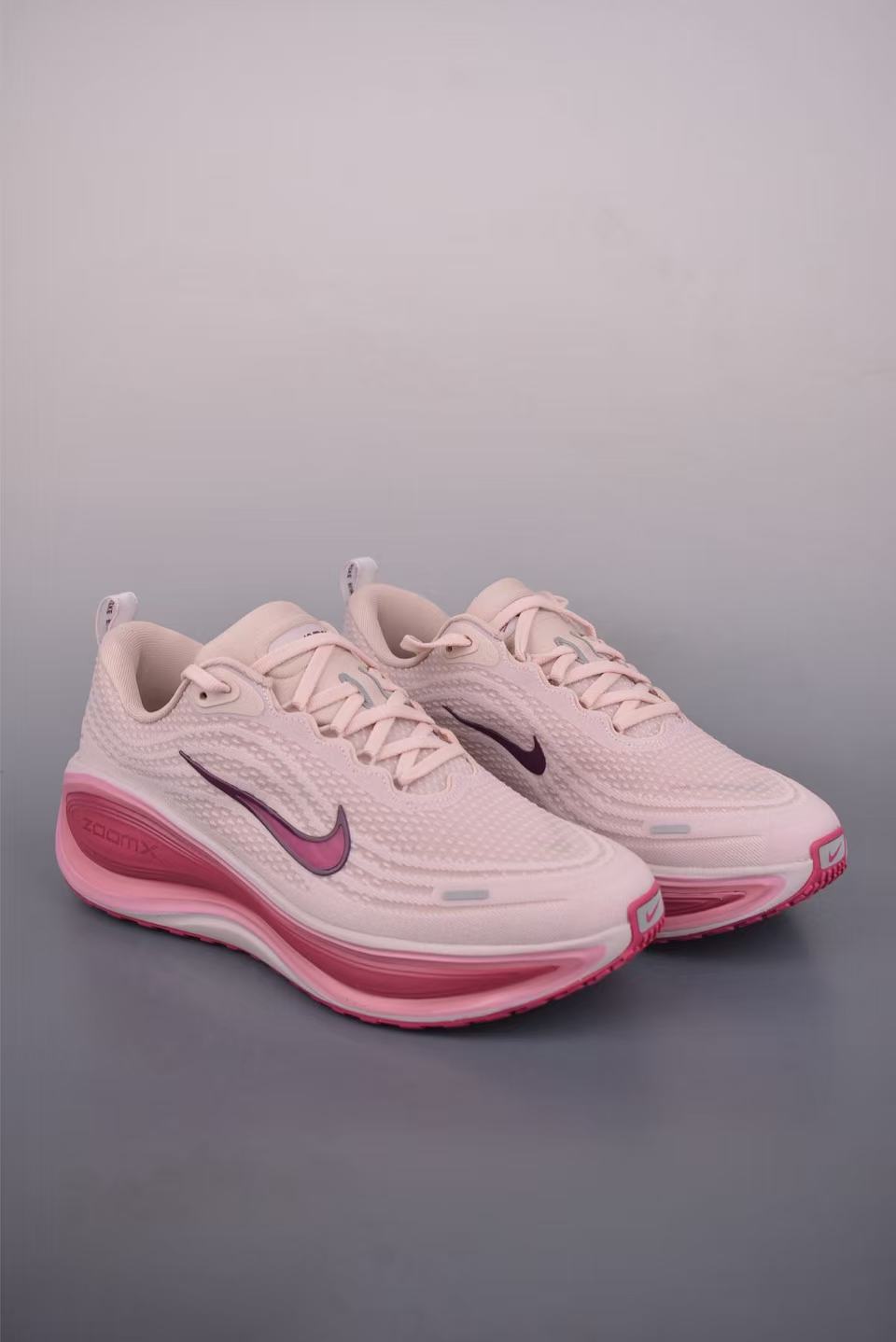 Nike Zoom Vomero in Grey/Pink: Metropolitan Serenity