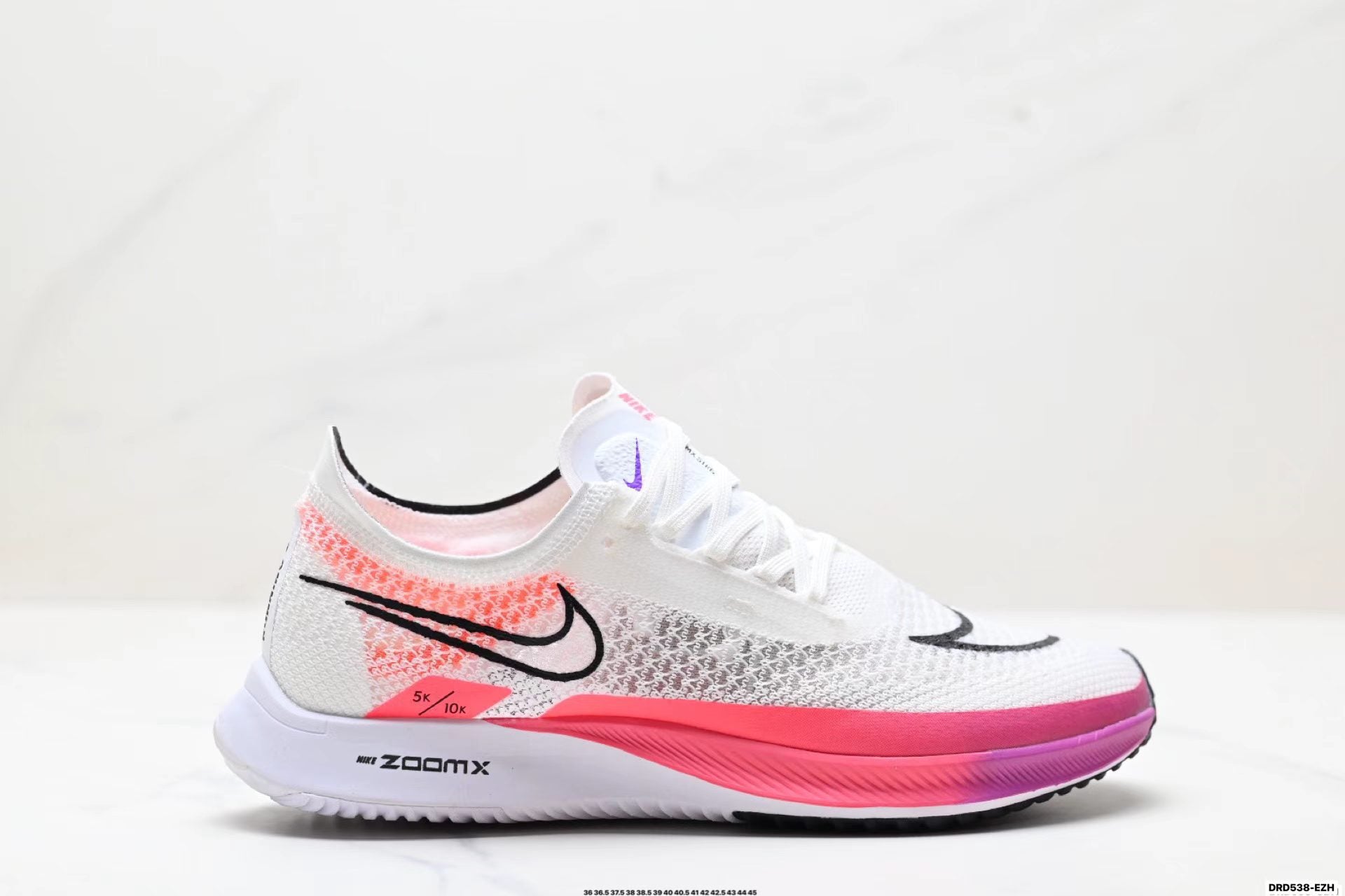 Nike ZoomX Streakfly in White/Black/Pink: Chromatic Spark