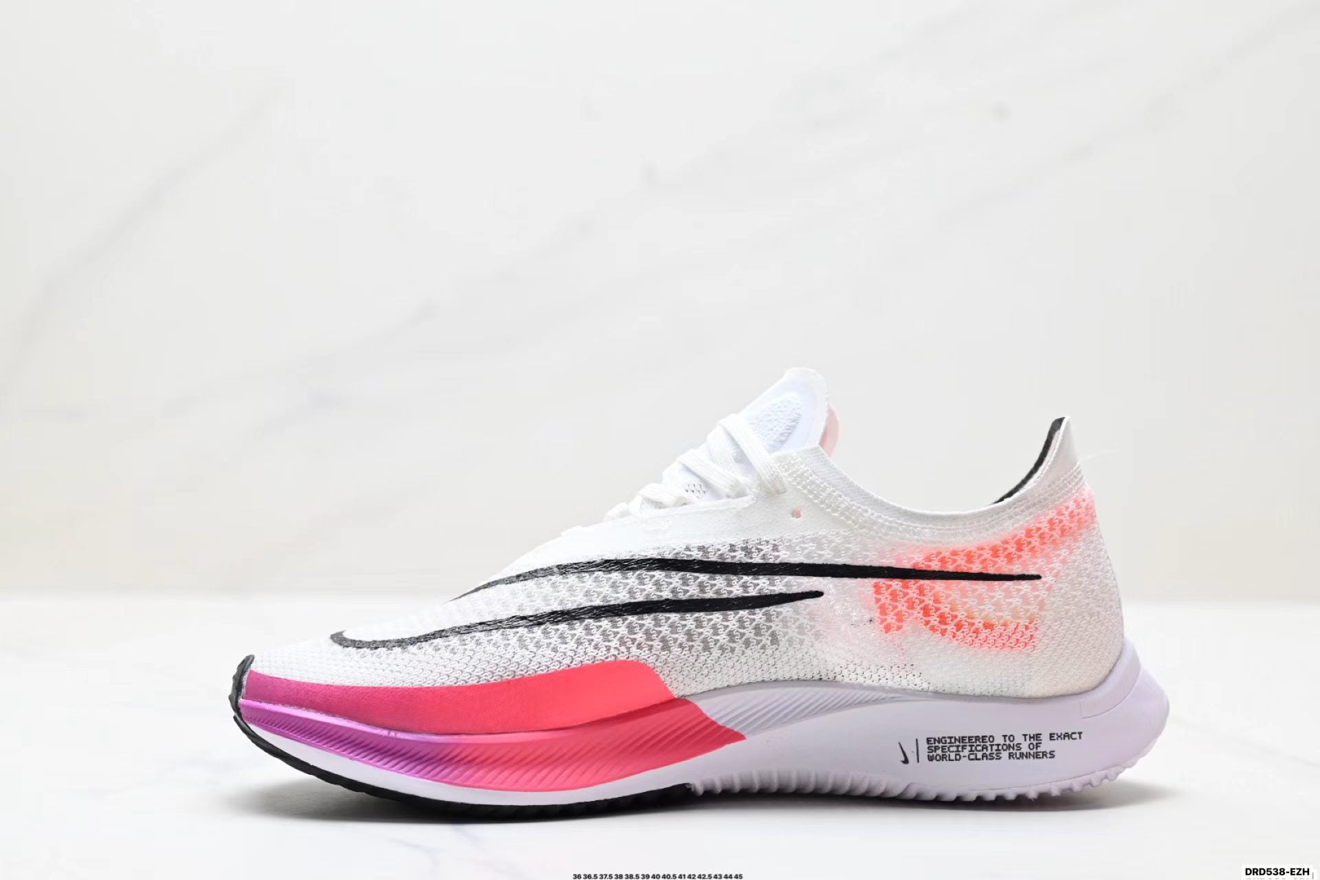 Nike ZoomX Streakfly in White/Black/Pink: Chromatic Spark