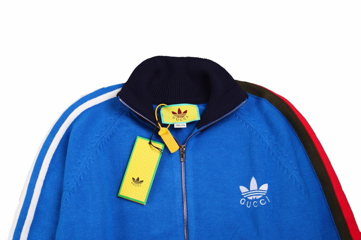 g*u*i x Ad*s blue track jacket