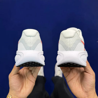 Nike Revolution 7 in White with Red Tab: Essential Contrast