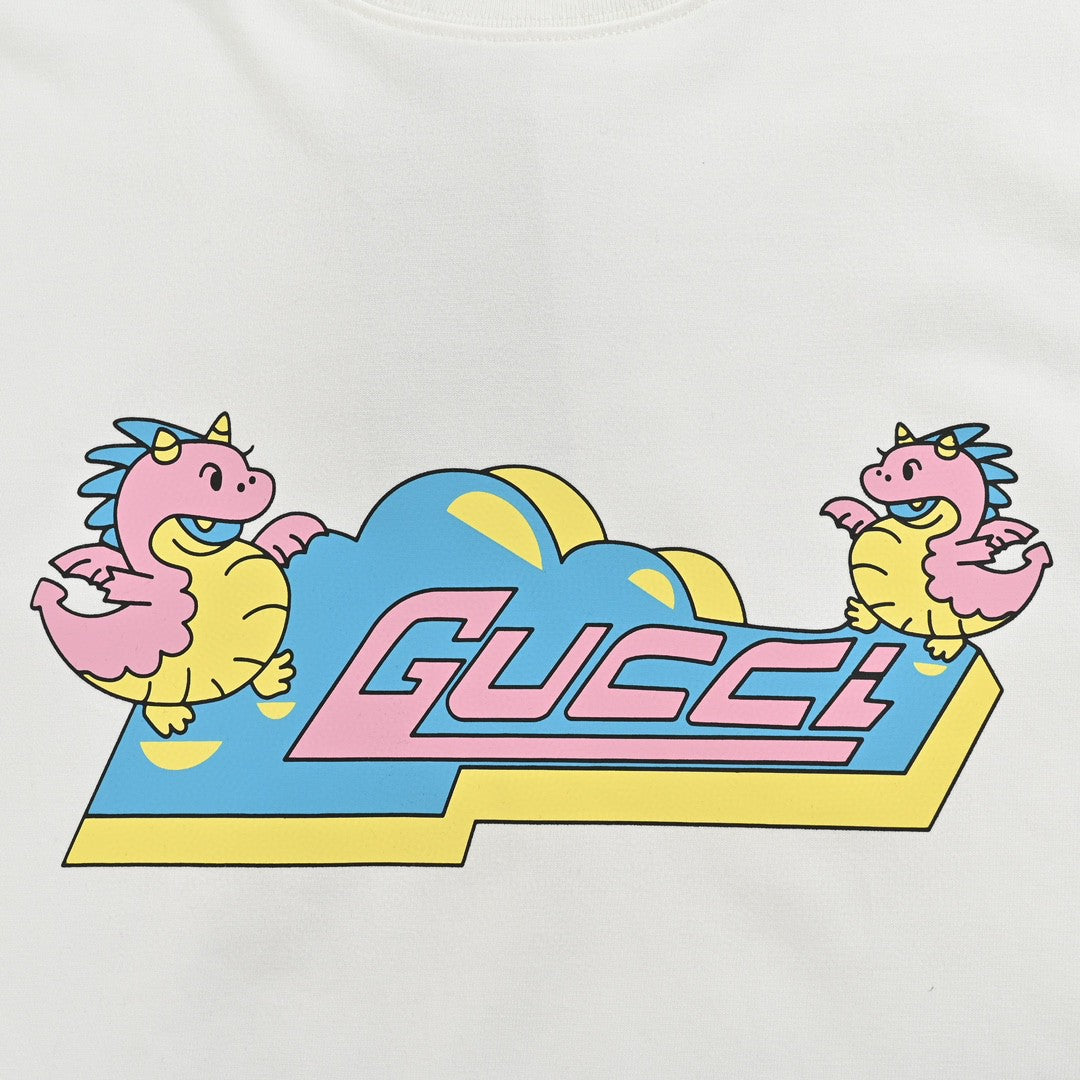 G*u*i white t-shirt with pink dinosaur graphic