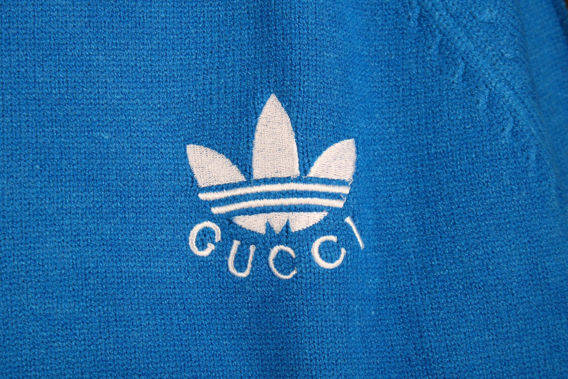 g*u*i x Ad*s blue track jacket