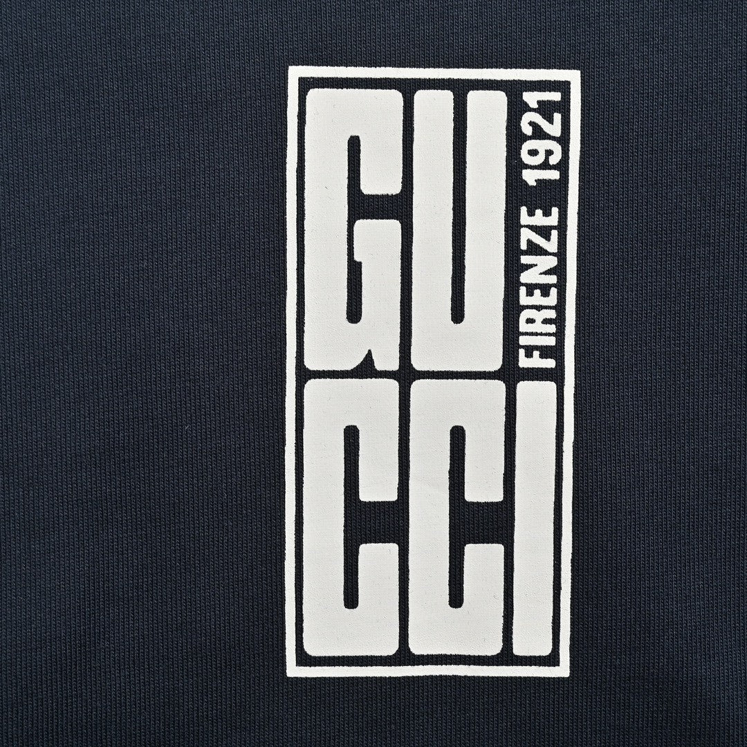 G*u*i navy blue t-shirt with vertical logo patch