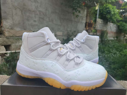 AIR JORDAN 11 RETRO "WHITE / EMBOSSED"