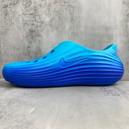 Nike ReactX Rejuvenation Slides in Blue: Aqua-Coded Recovery