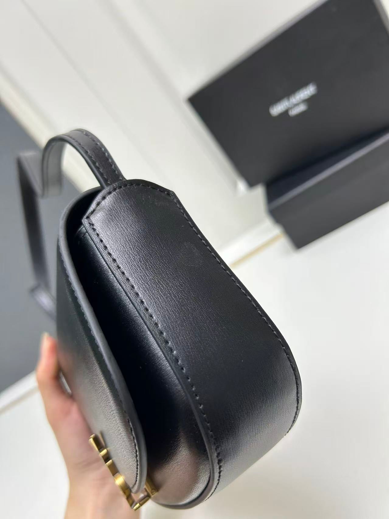 Saint Laurent Black Bag with Gold Closure
