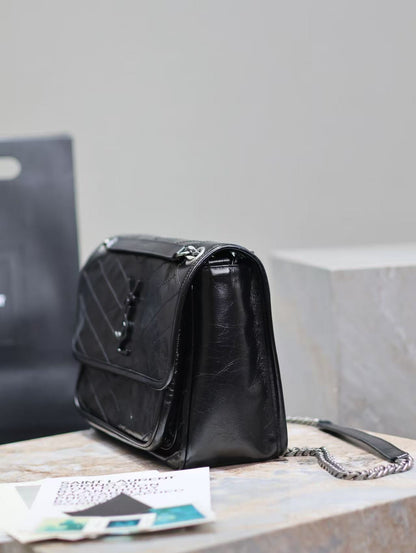 Saint Laurent Black Bag with Silver Chain