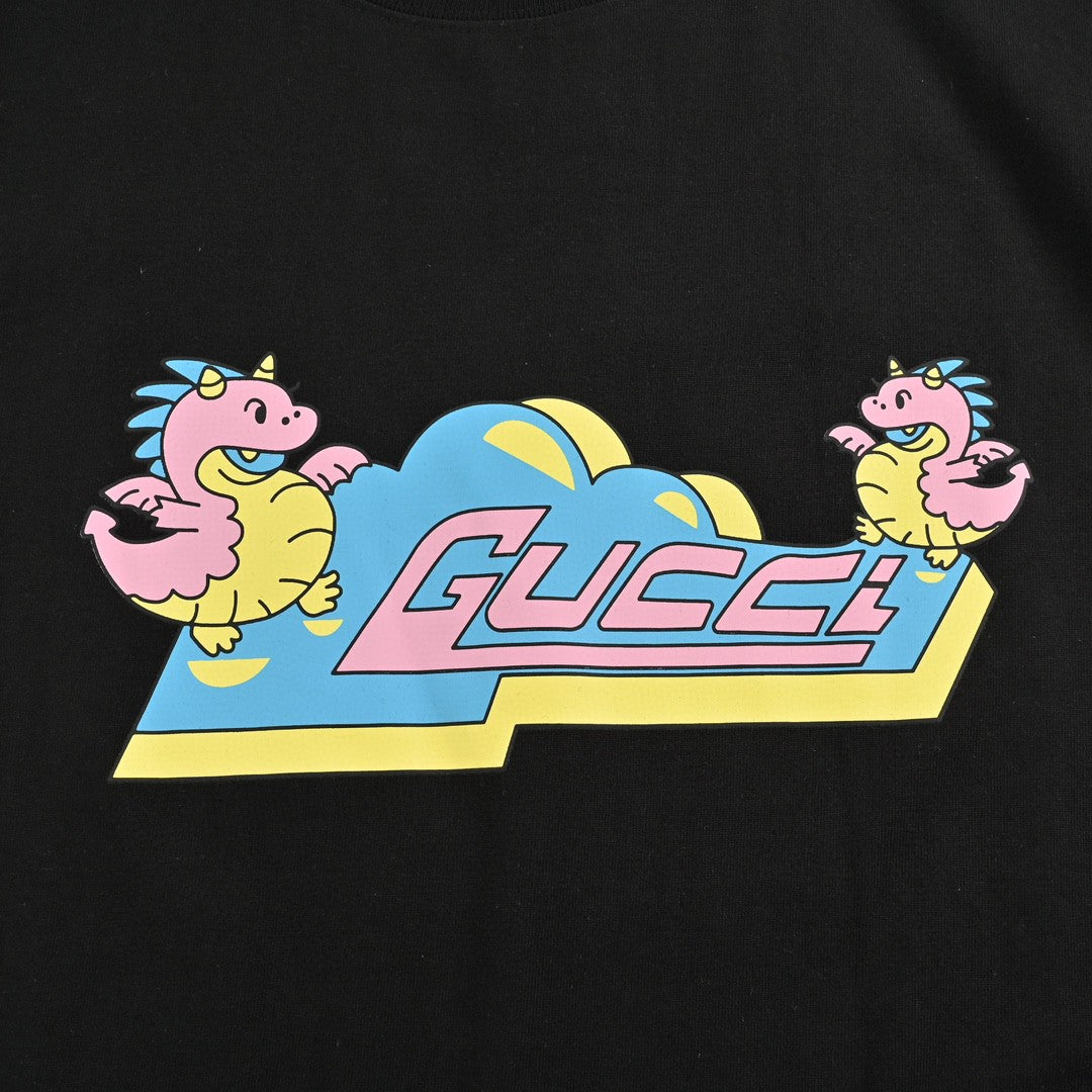 G*u*i black t-shirt with pink dinosaur graphic