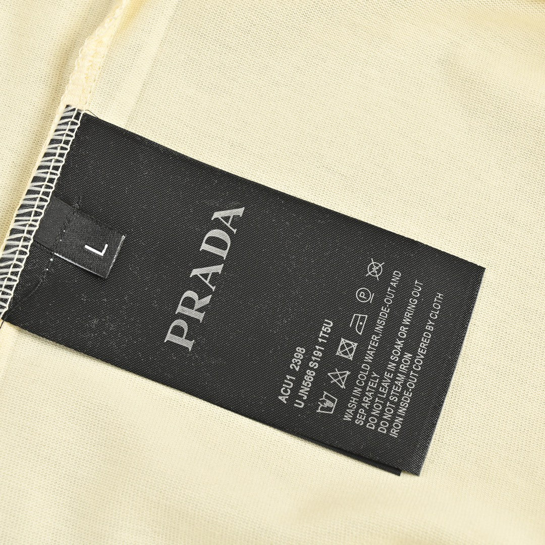 Pra*a t-shirt - cream with bold branding