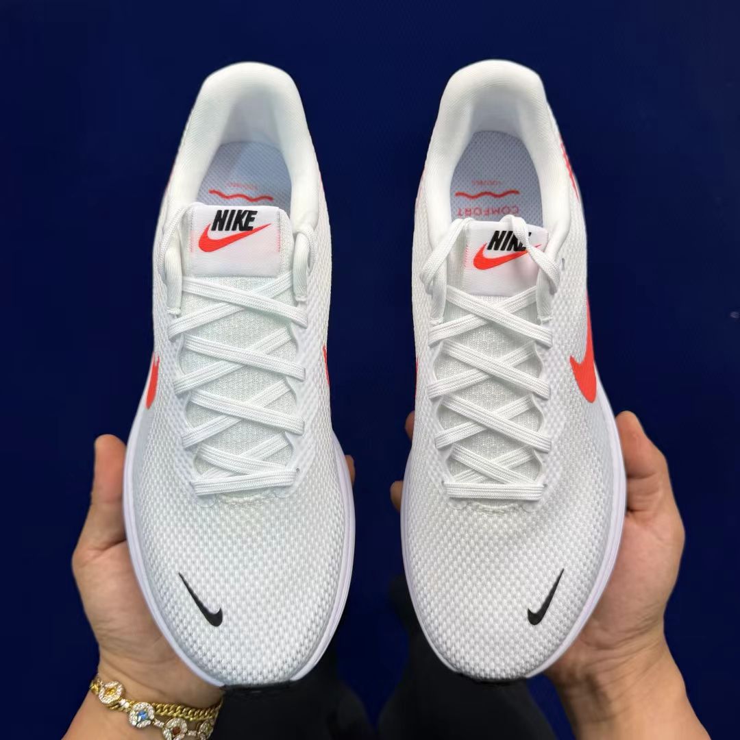 Nike Revolution 7 in White with Red Tab: Essential Contrast