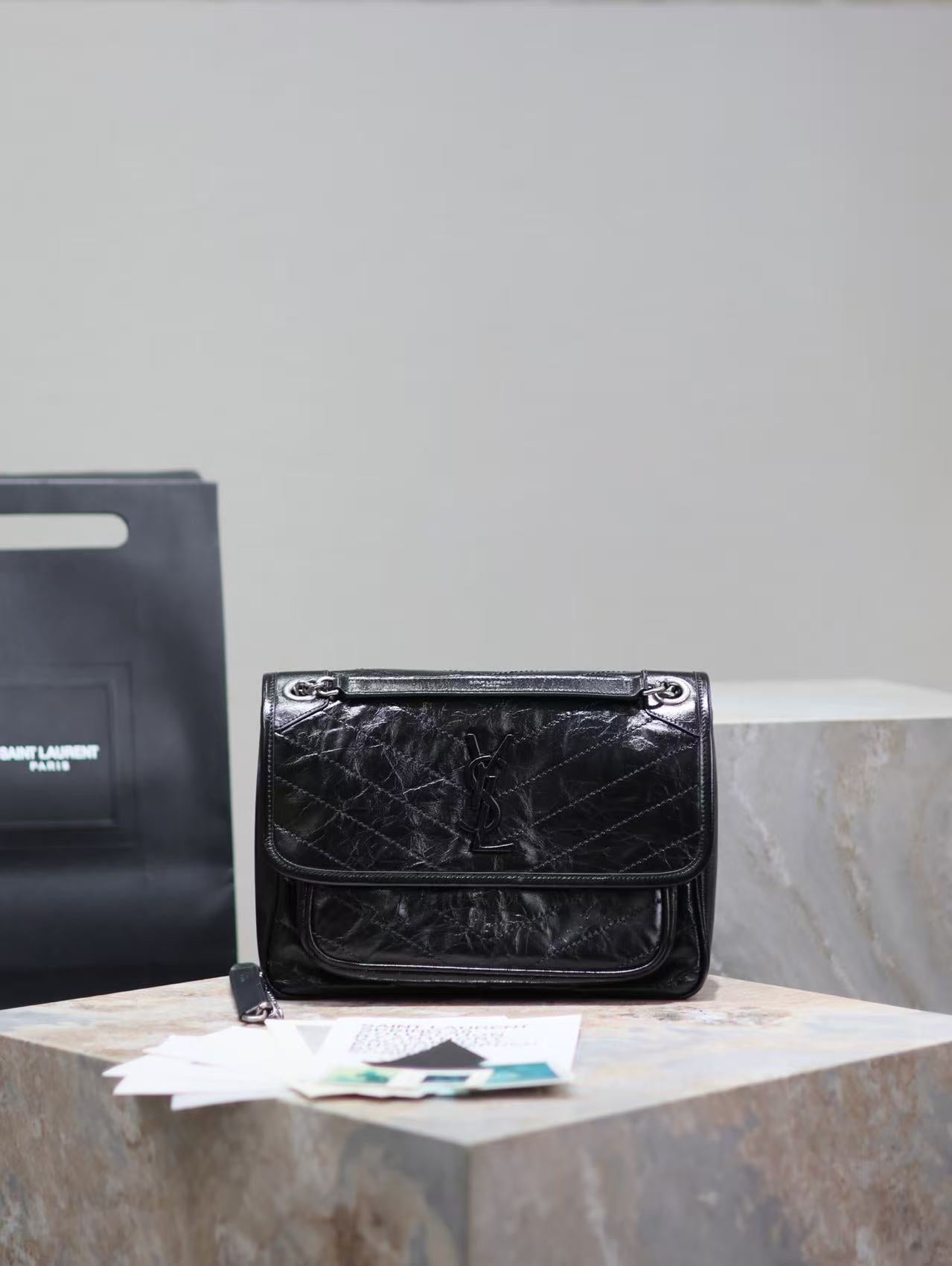 Saint Laurent Black Bag with Silver Chain