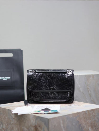 Saint Laurent Black Bag with Silver Chain