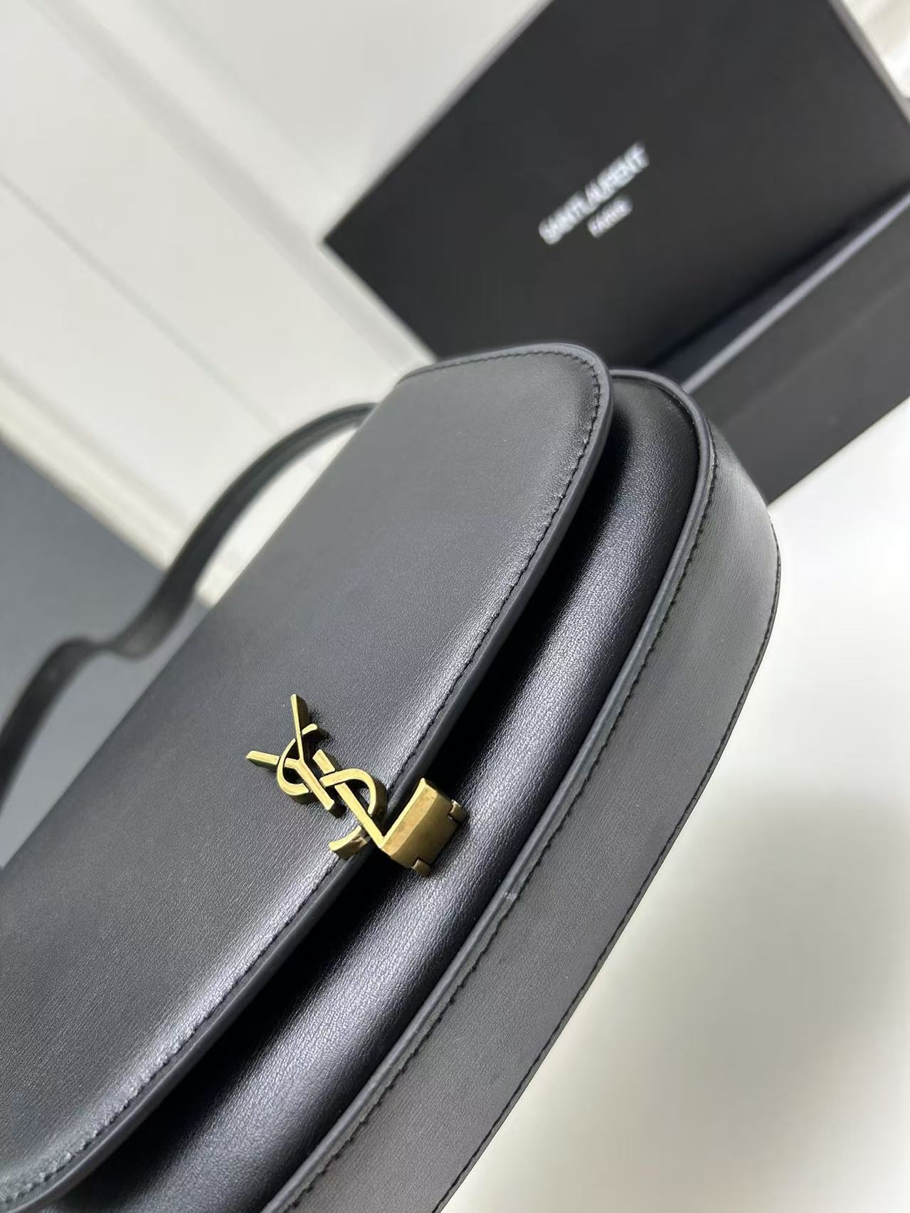 Saint Laurent Black Bag with Gold Closure