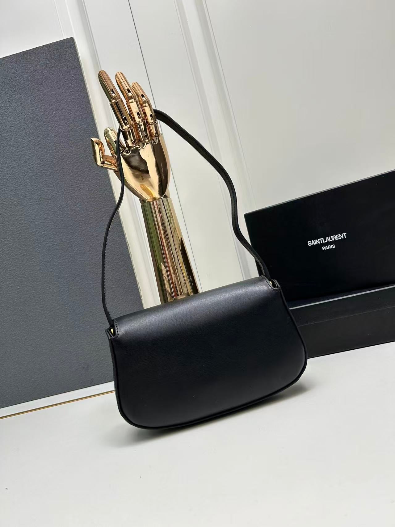 Saint Laurent Black Bag with Gold Closure