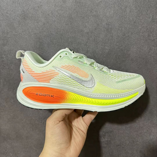 Nike Zoom Vomero in Green/Orange: Biomechanical Gradient