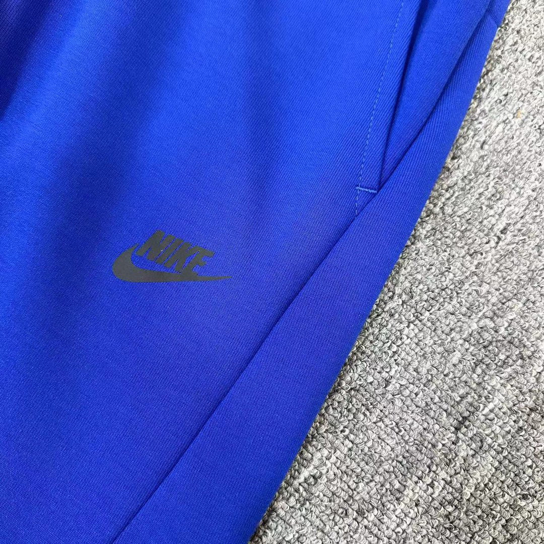 Nike modern fleece hot sale pants blue